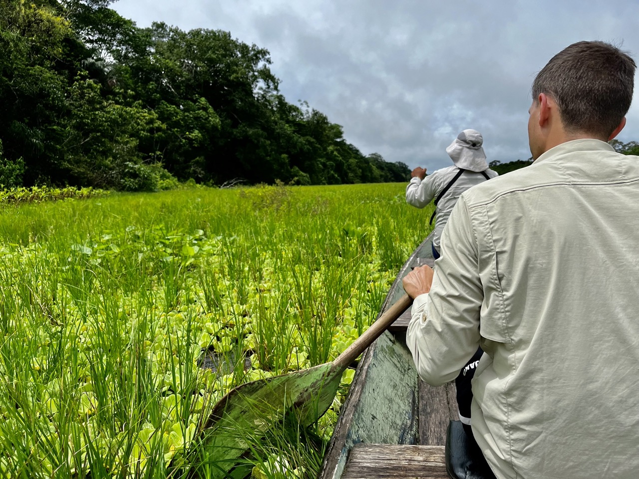 Earlier that day: pushing the boat through the tall grass and floating plants